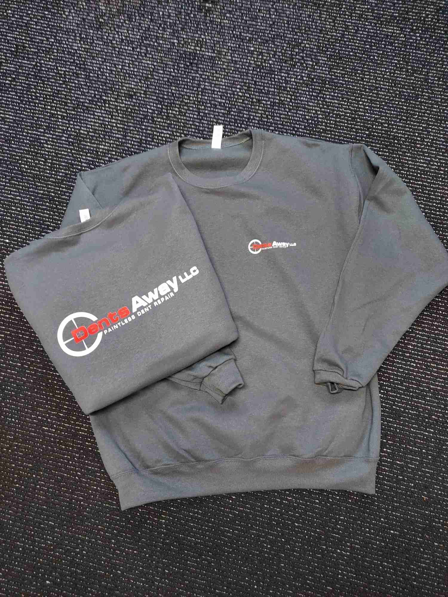 Gray crewneck sweatshirts screen printed with a Dents Away paintless dent repair company logo — Ultimate Swag, Mooresville NC