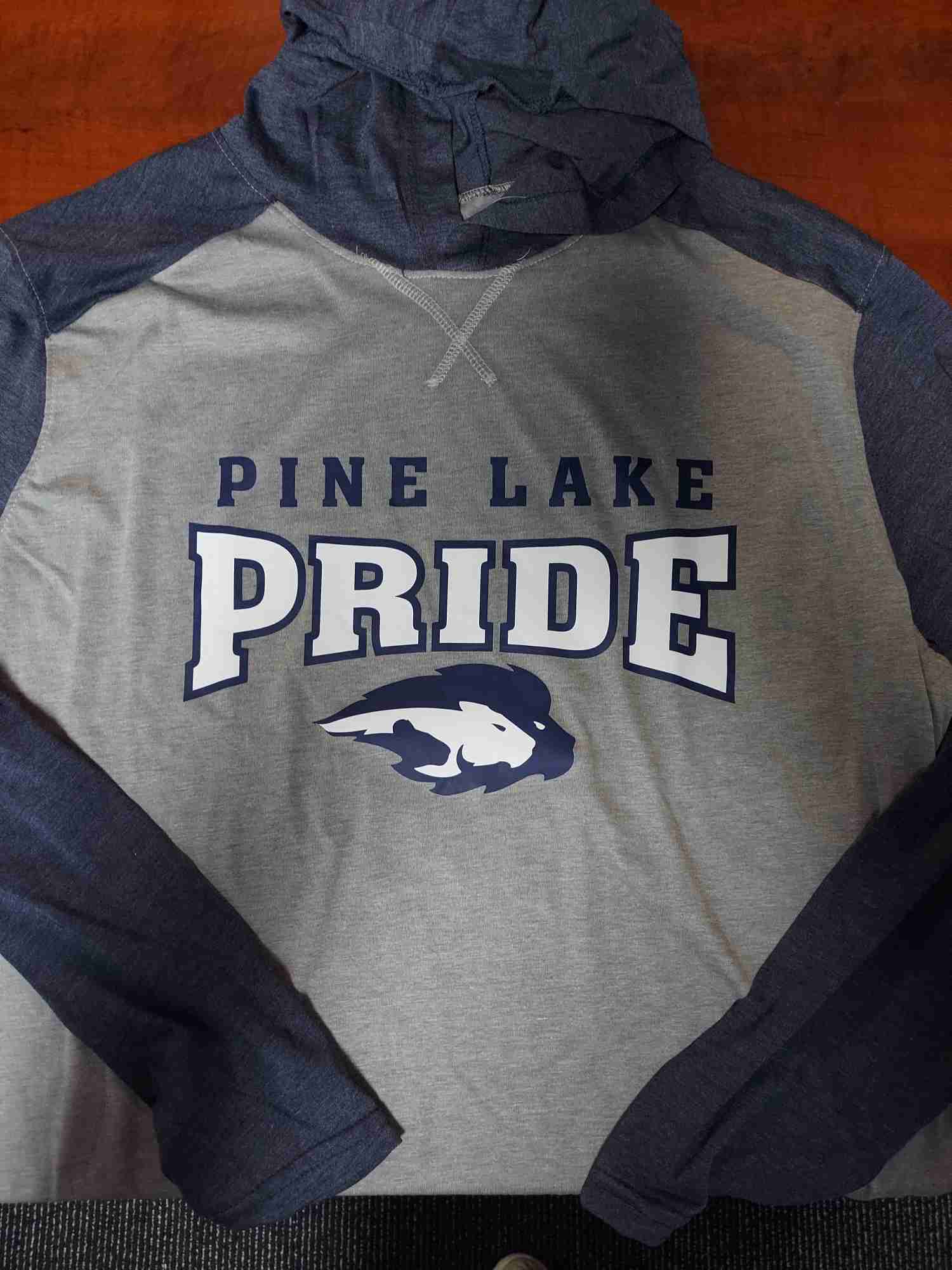 Gray and navy raglan hooded tee printed with Pine Lake Pride mascot spirit wear design — Ultimate Swag, Mooresville NC